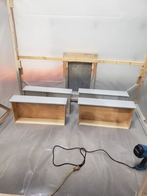 Painh Booth in use to paint cabinet drawers